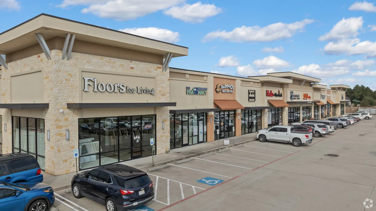 Full storefront row of a completed multi-tenant shopping center